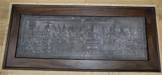 A reproduction Indonesian temple plaque, cased